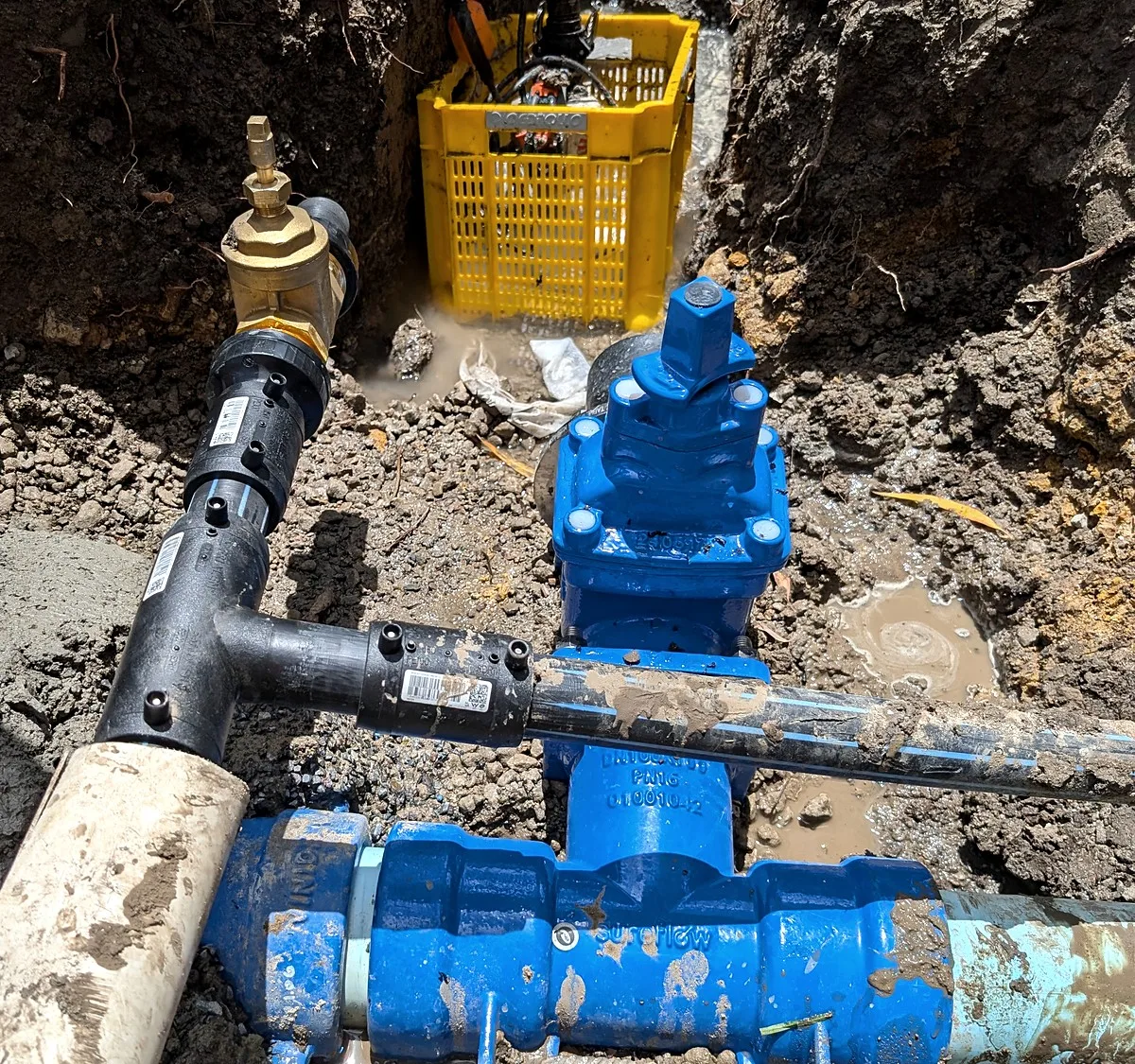 Burst fire service repair in Melbourne, a new gate valve and tee fitted to an underground fire main