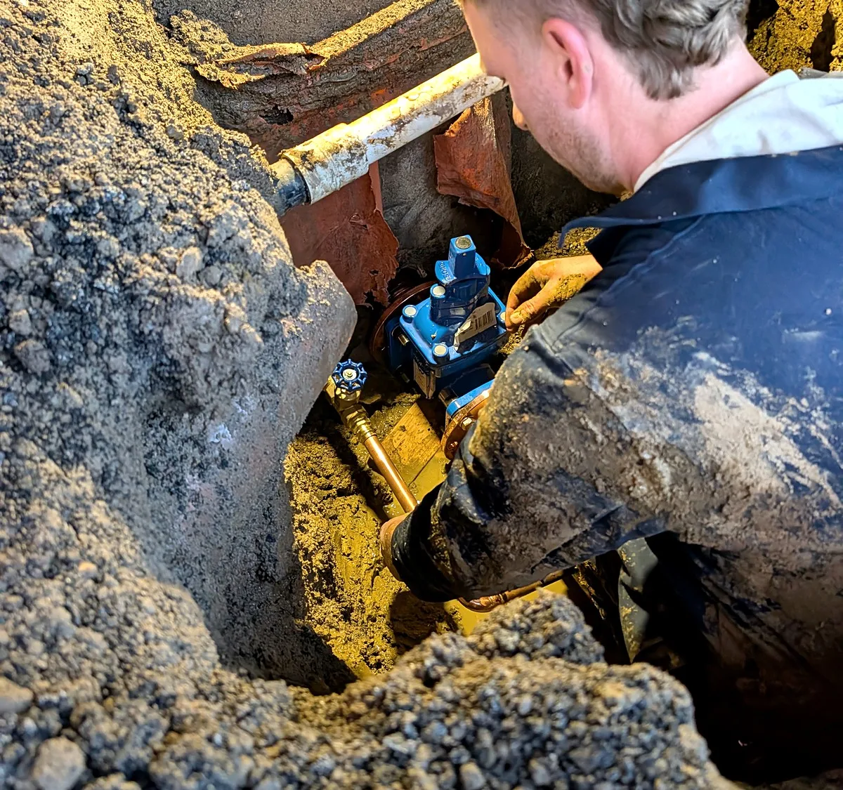 Giant Plumbing team member replacing an isolation valve on an underground fire service in Melbourne