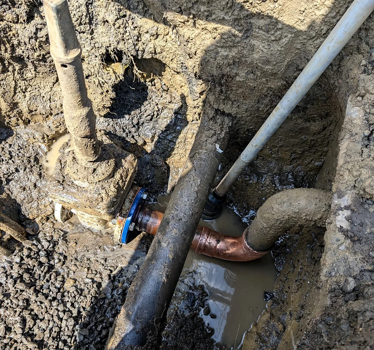 Burst fire service exposed for repair in Melbourne, the old failed valve and corroded pipe in the dig