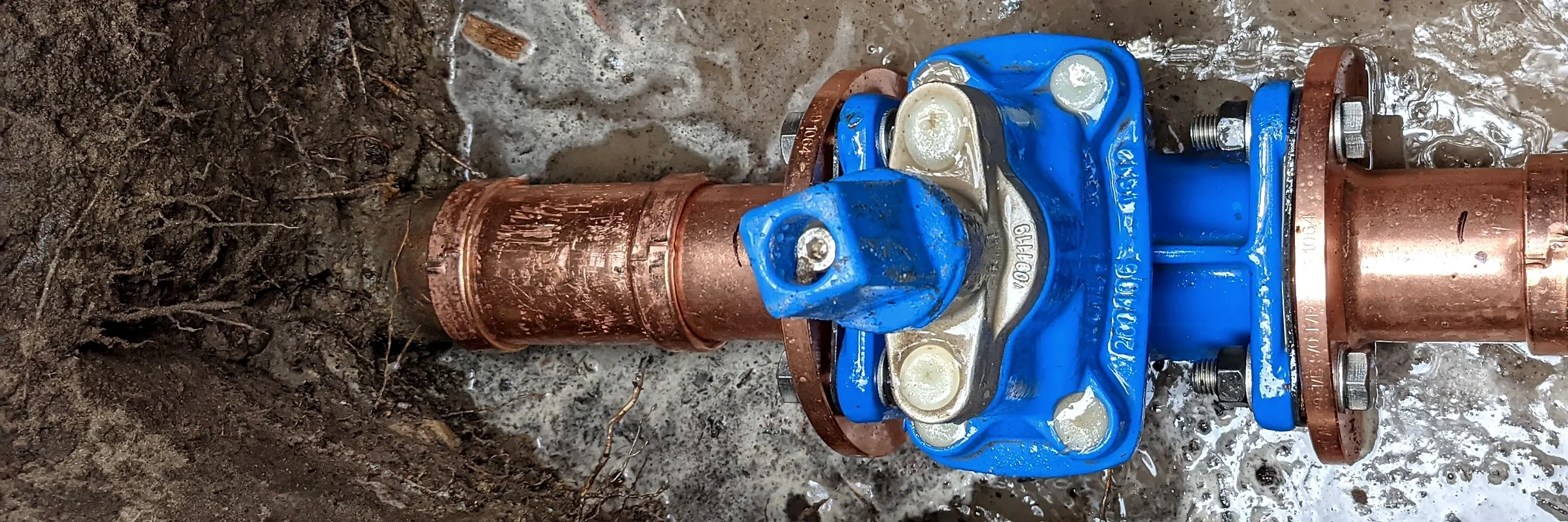 New valve fitted to an underground fire service main in an excavated trench