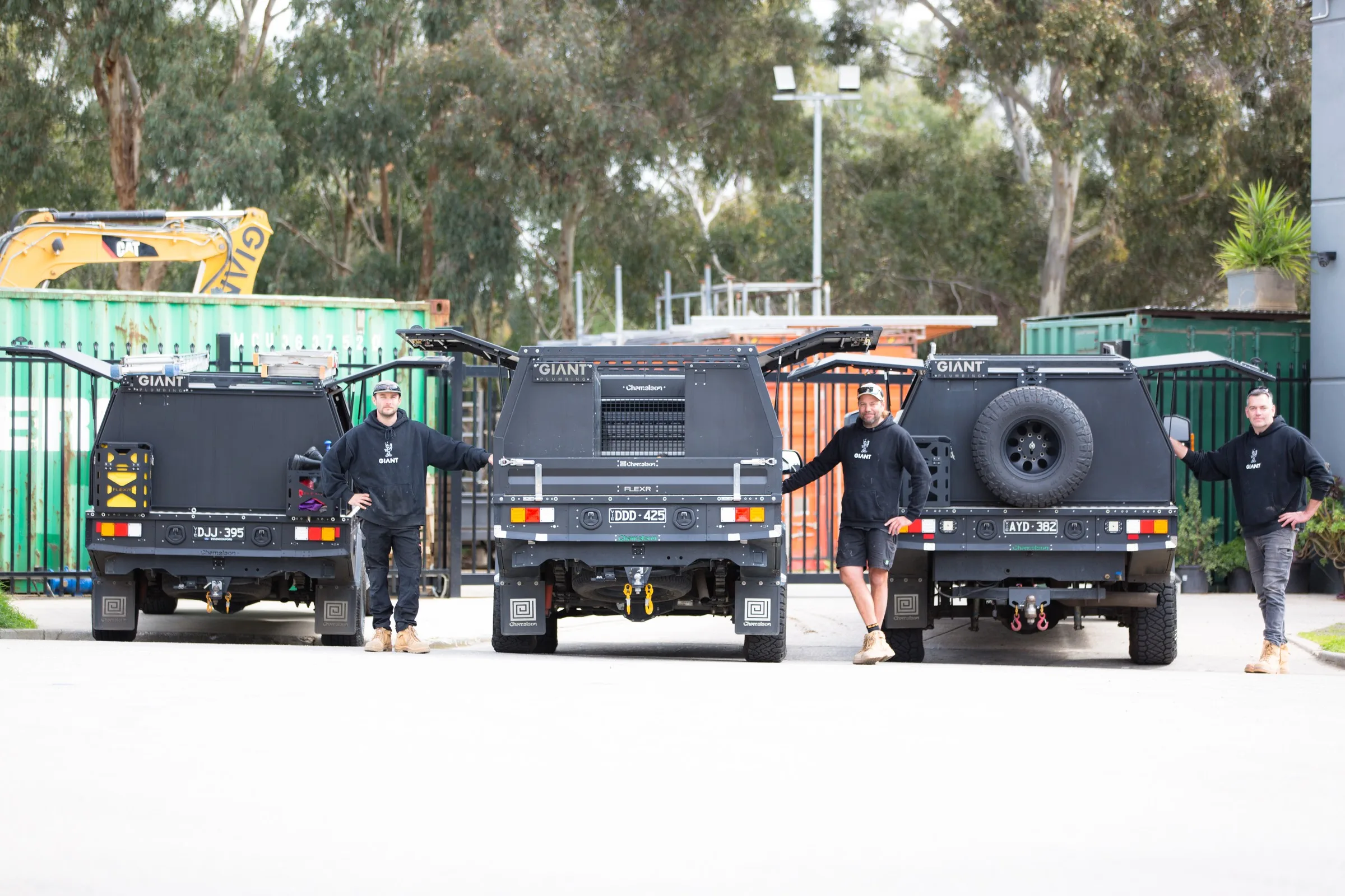 Giant Plumbing work utes lined up at the yard
