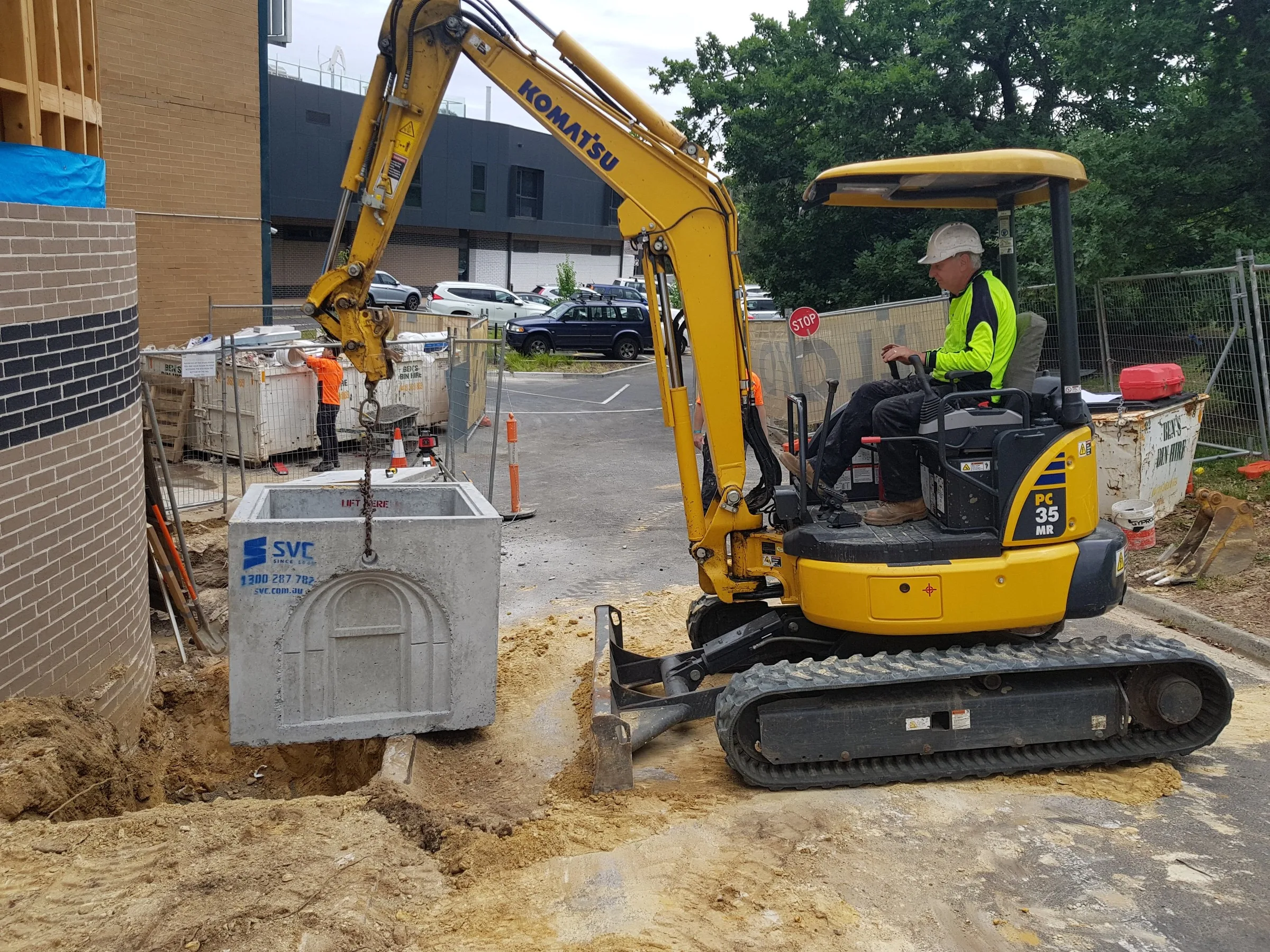Giant Plumbing excavation equipment at a work site